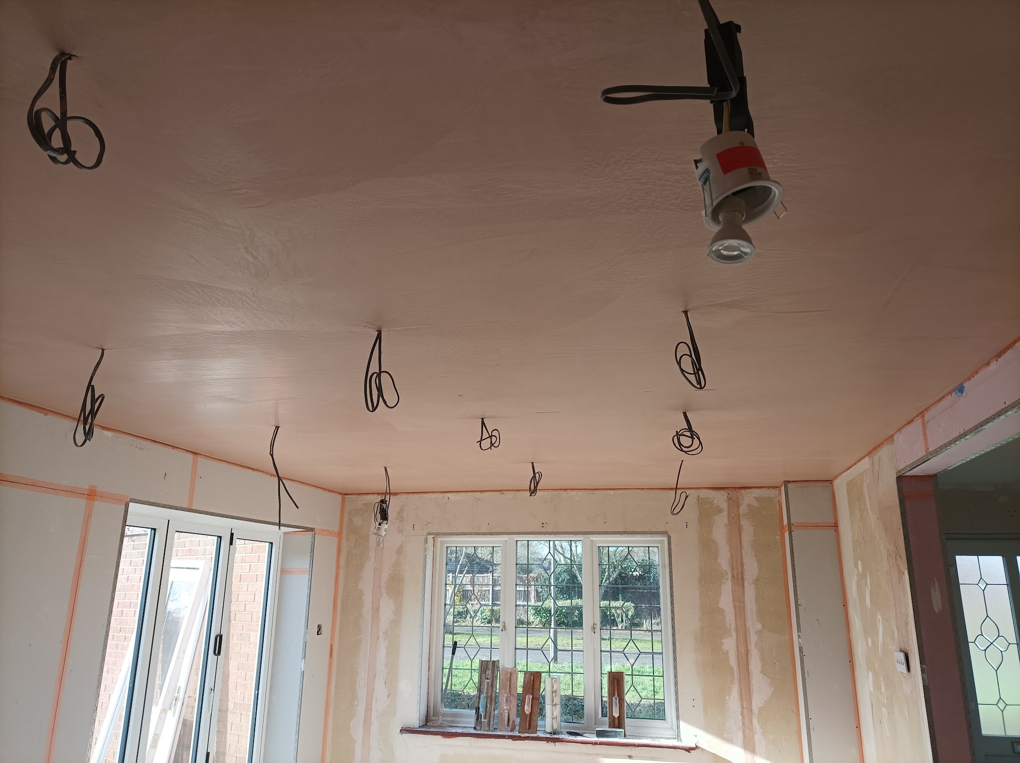 A room with a newly skimmed ceiling and walls